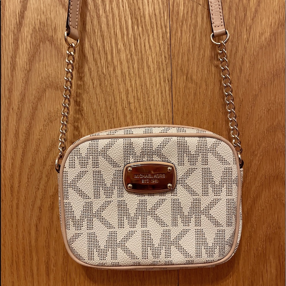 Cream colored Michael Kors cross body.